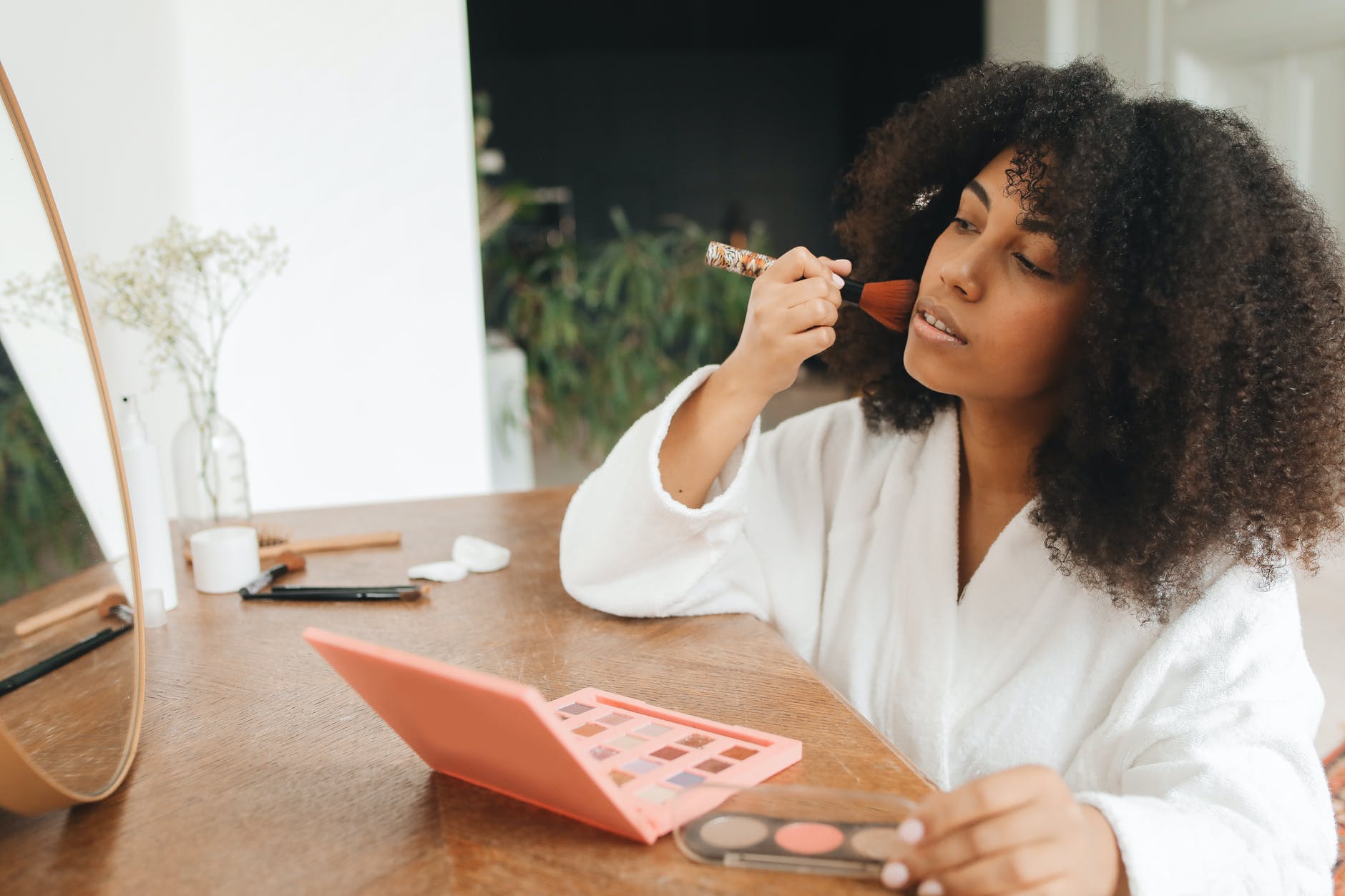 woman applying makeup